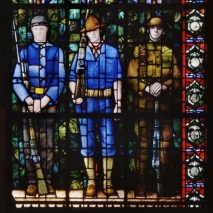 Detail from Grant Wood, Veterans Memorial Window, 1929. The figures depicted represent veterans of the Civil War, the Spanish-American War, and World War I. For more information, see the Grant Wood Window page of the Veterans Memorial Commission in Cedar Rapids. Image courtesy of the Veterans Memorial Commission, Cedar Rapids.